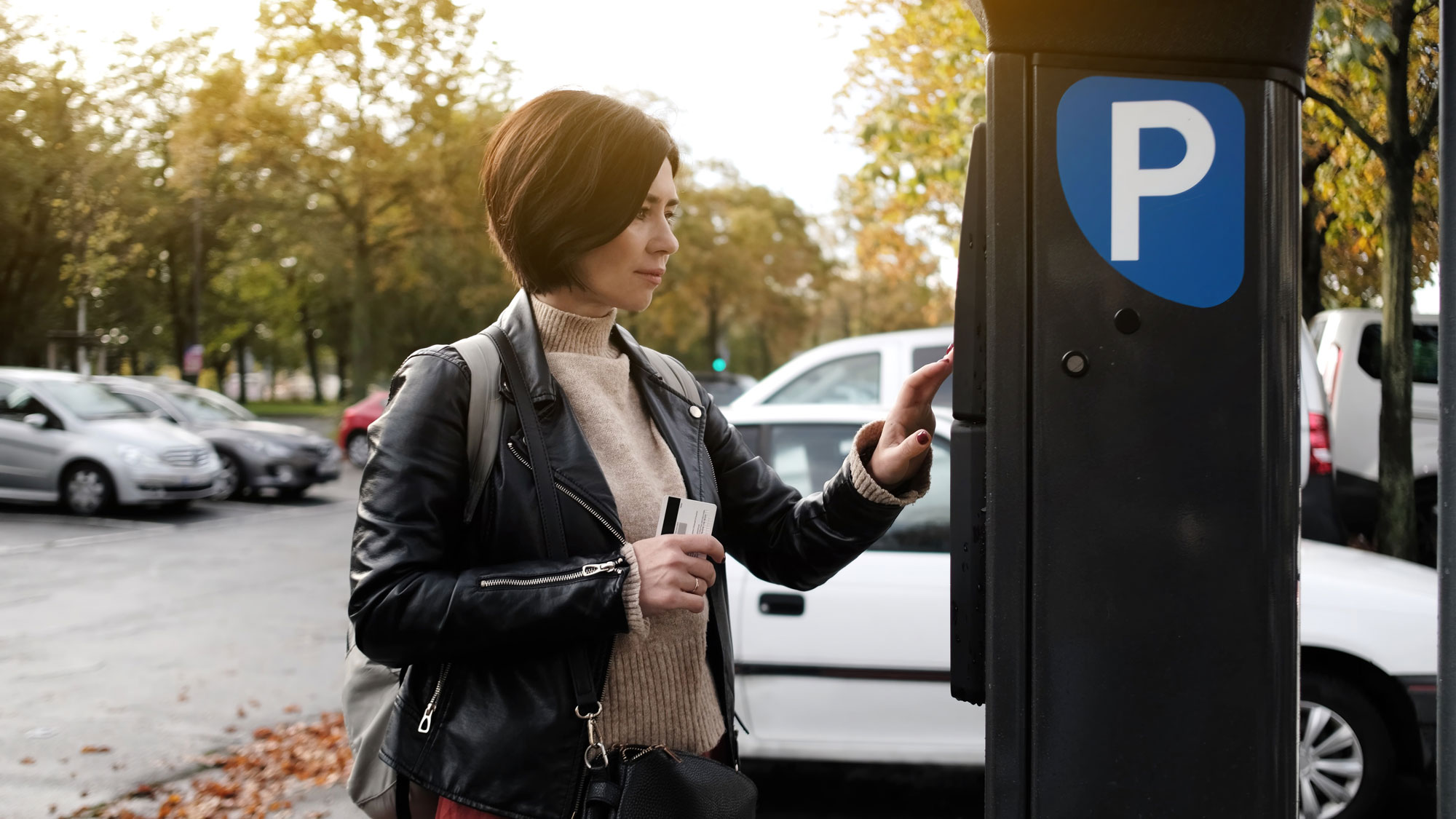 Woman paying for parking with a credit card